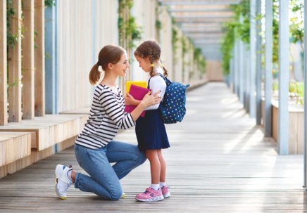 mother and daughter outside school