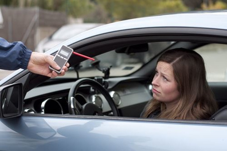 woman getting breathalyzed