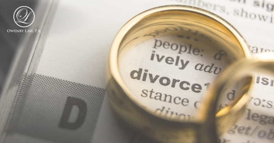 divorce dictionary with a wedding ring over it