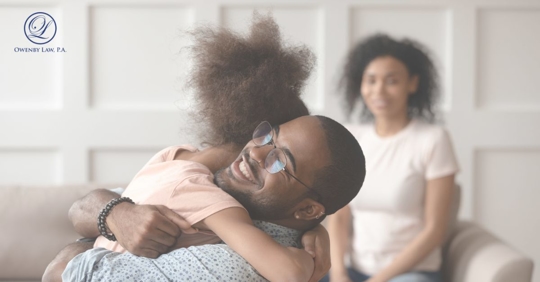 father hugging daughter