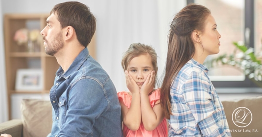 a child in between arguing parents