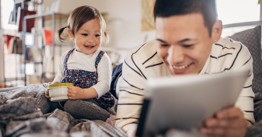 Father and daughter smiling