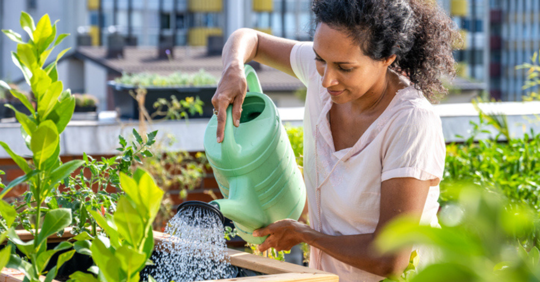 Woman watering her flowers