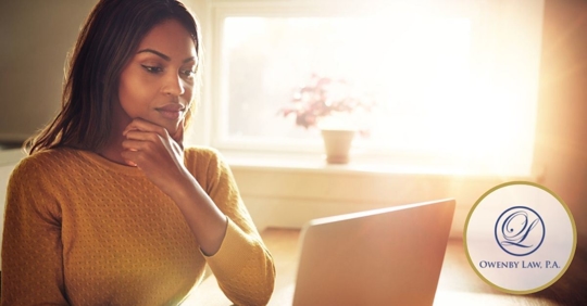 African American sitting in front of her laptop