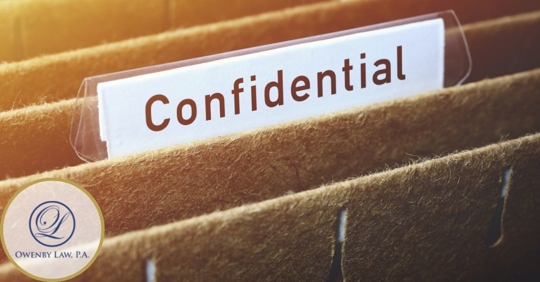 file folder with a label that reads, "Confidential"